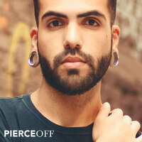 Stylish man with double flared eyelets in stretched lobes