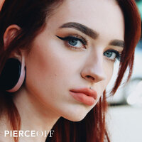 fashionable woman with medusa piercing wearing bioplast clawset jewelled labret