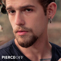 Young man with a heavy gauge ring in stretched lobe