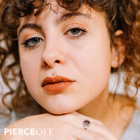 cute curly haired girl with medusa piercing
