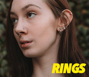 Young woman with multiple ear piercings