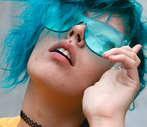 fashionable young girl with sunglasses and philtrum medusa lip piercing jewellery