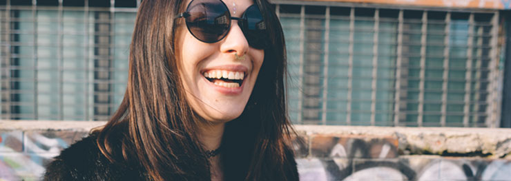 Woman with a septum piercing laughing