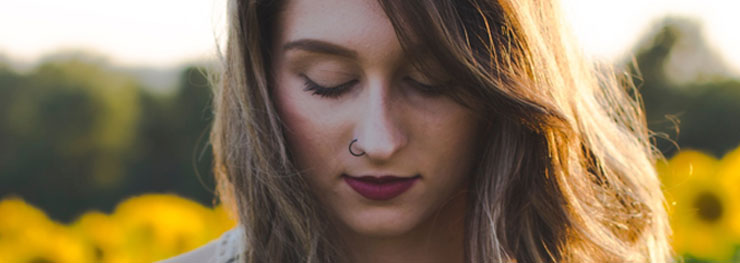 Wavy haired girl with nose ring