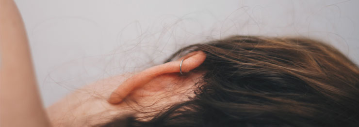 Close up of woman with ear piercing